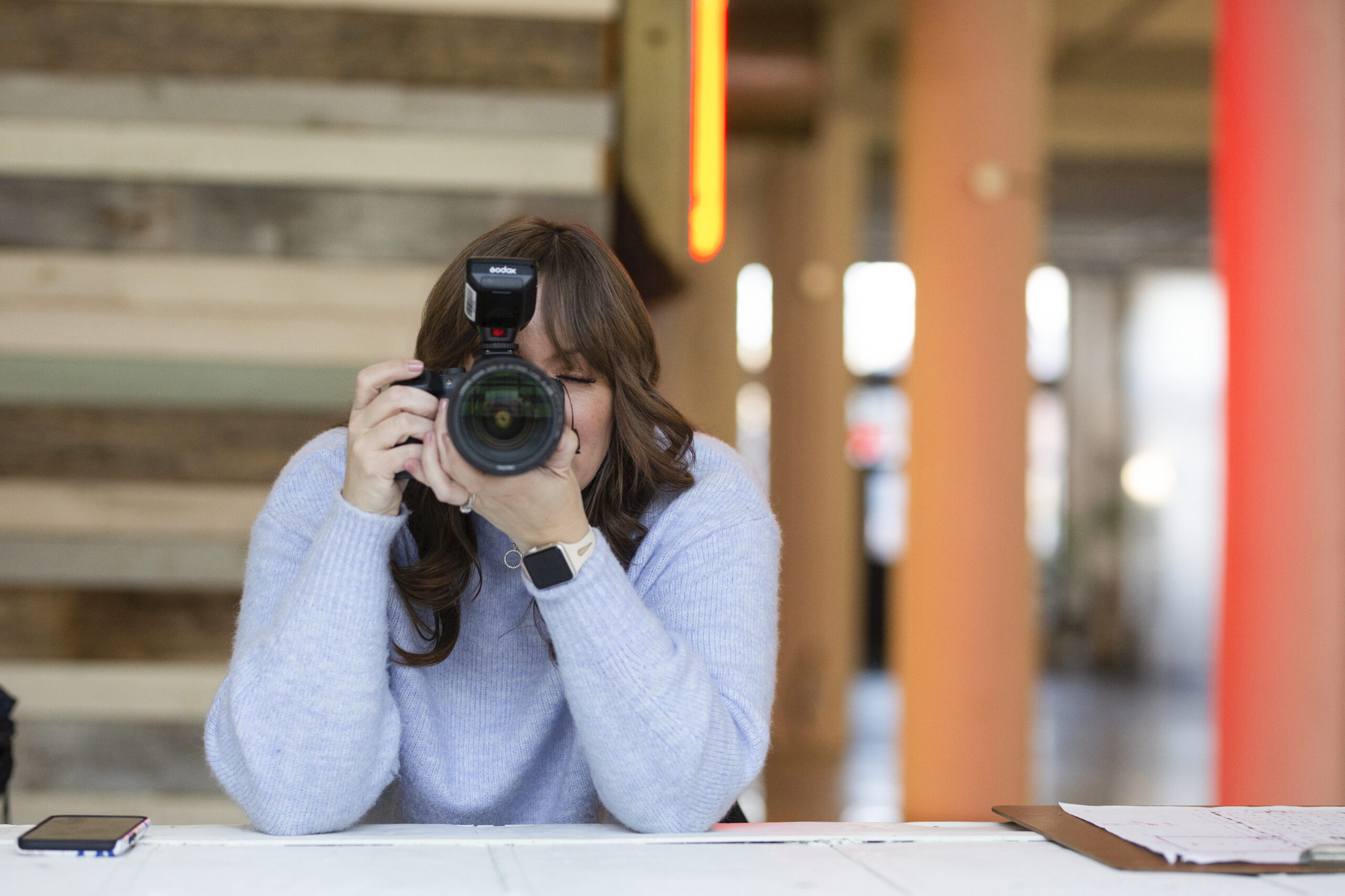 woman holding a camera