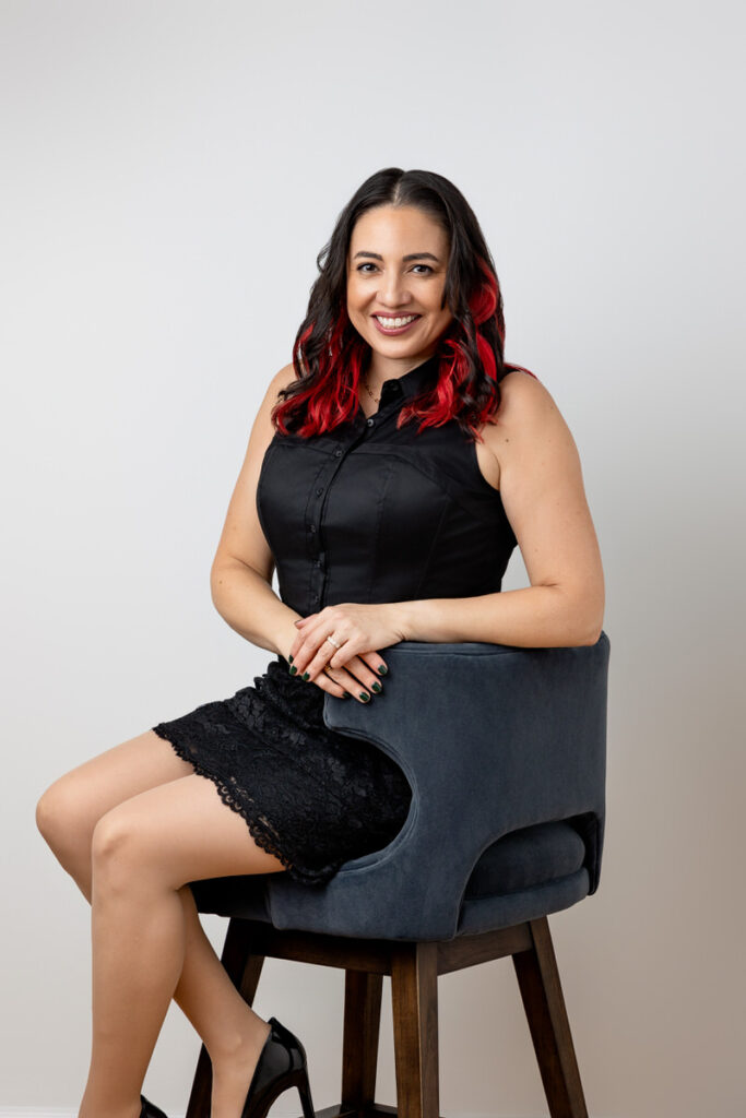 A person sitting in a chair smiling