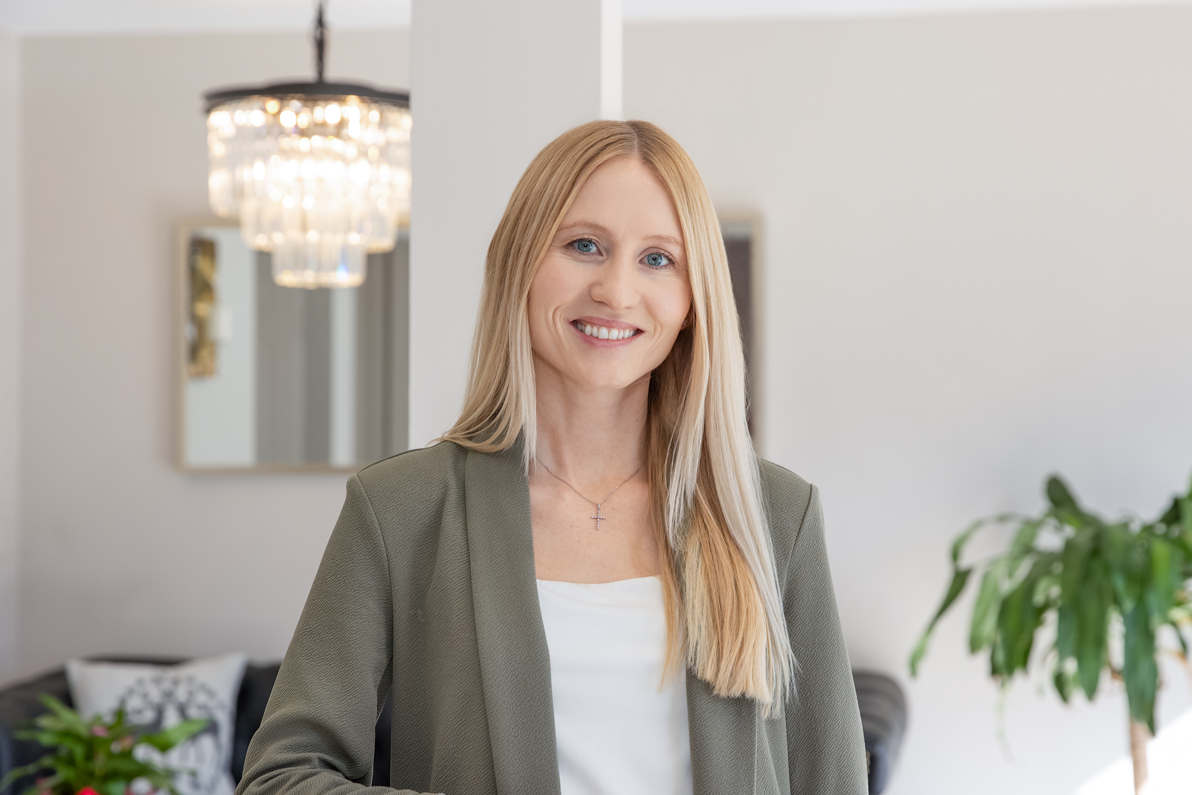 woman in business attire smiling 