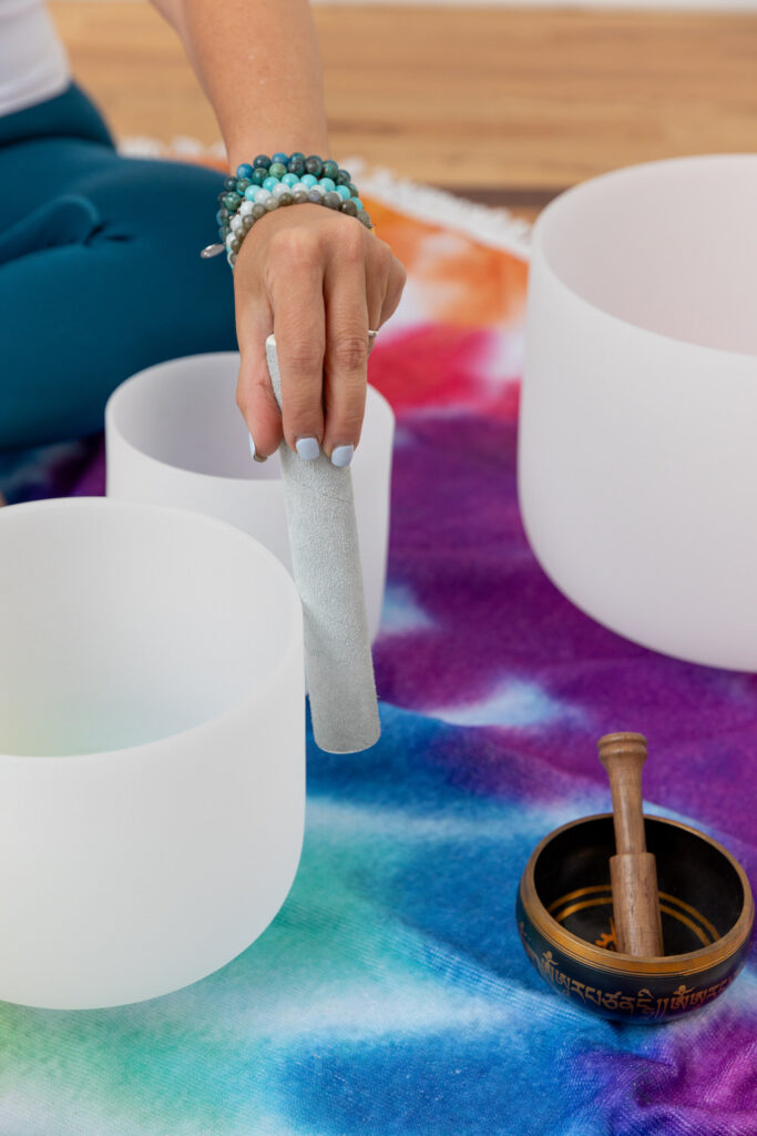 Close up of someone performing a sound bath.