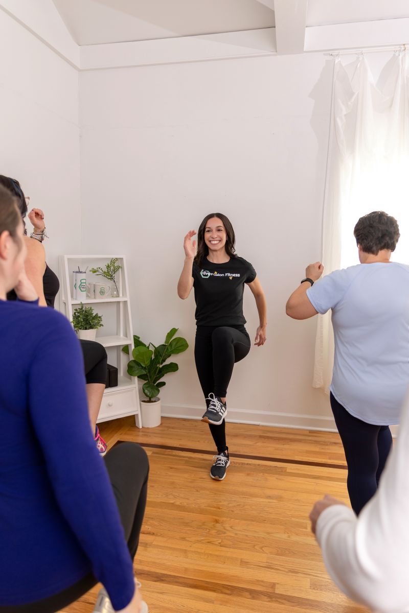 a woman leading an exercise class at hive fusion fitness in lemont illinois 